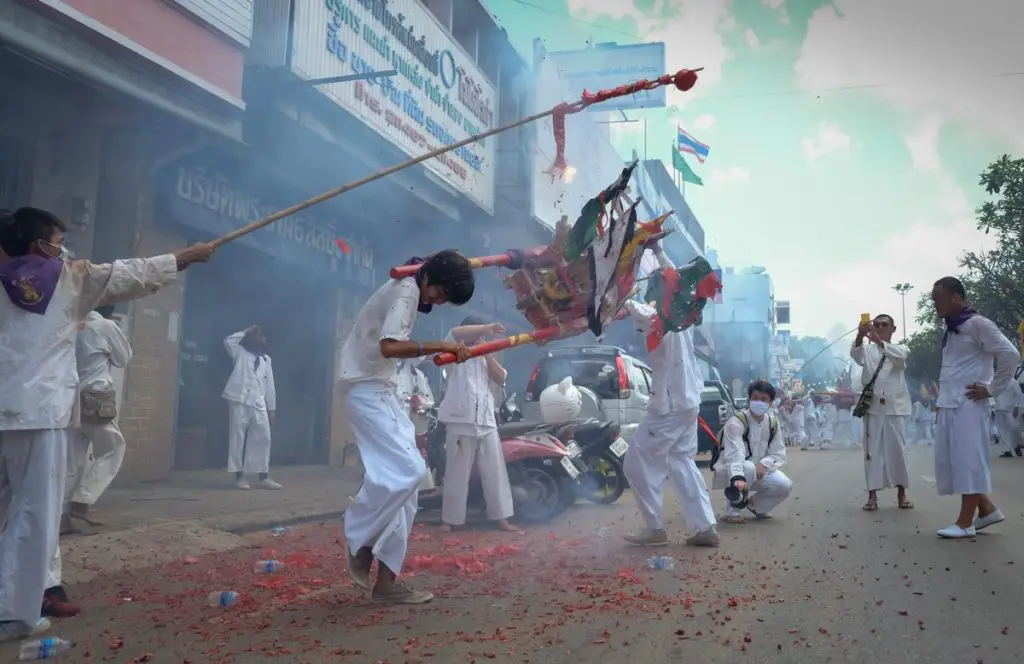 Trang Vegetarian Festival, devotees with fireworks on the street